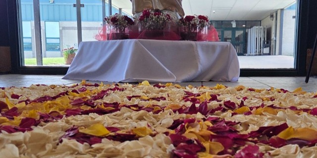 Flower petals laid at the feet of the Sacred Heart in preparation for the Eucharistic Procession at St. Joseph Parish in Imperial, MO